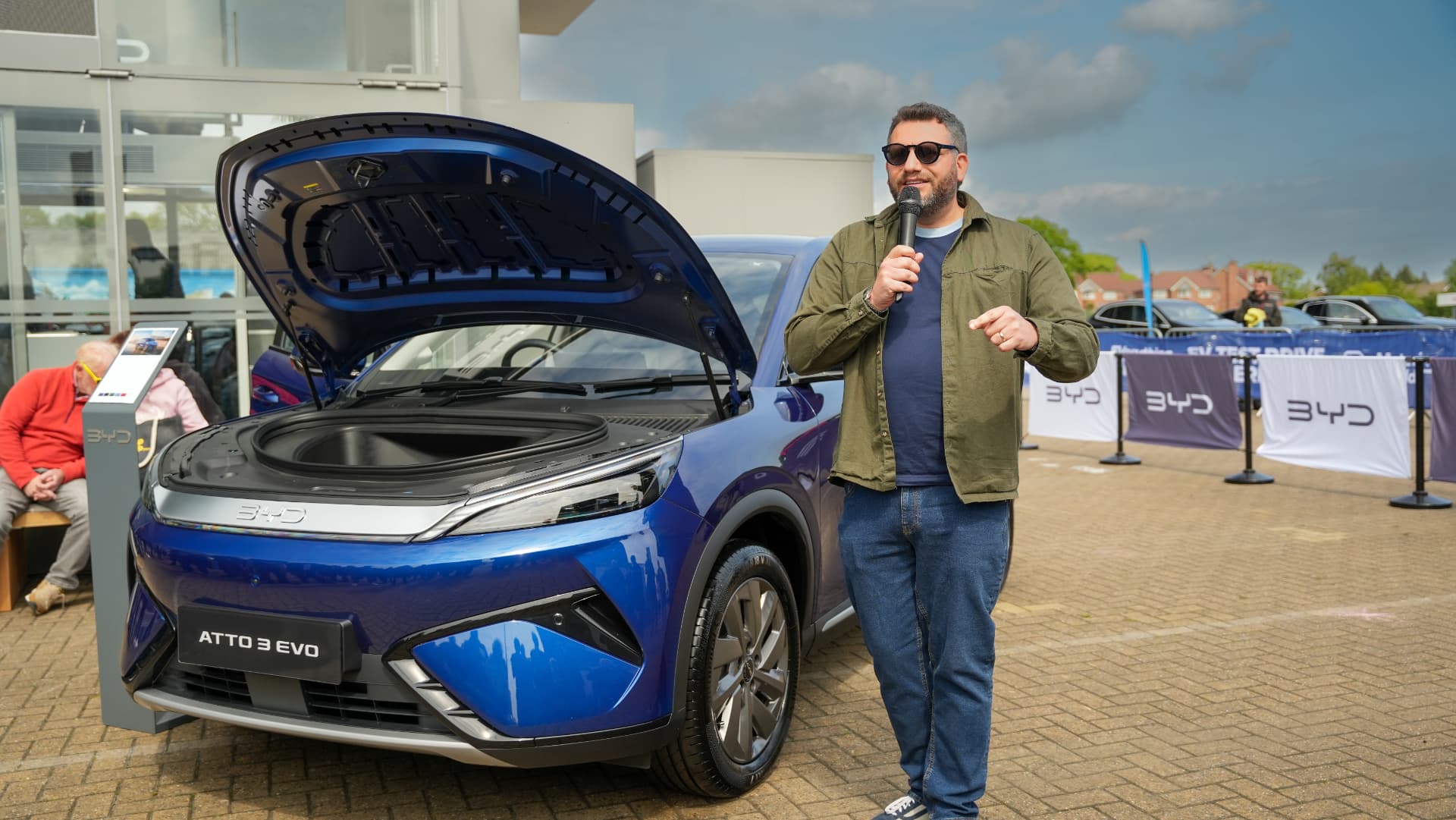 Stuart Porro hosting a BYD Atto 3 EVO test drive event at a dealership